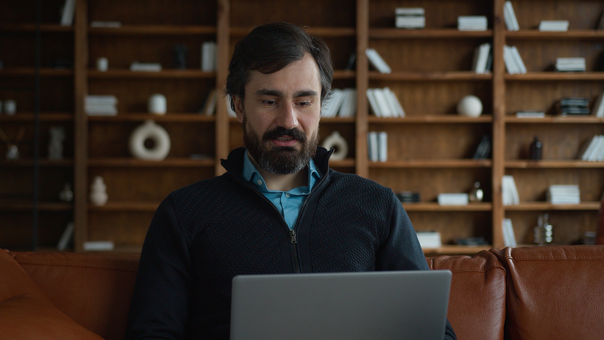 Mature Caucasian business man male businessman psychologist using laptop pc computer device talking