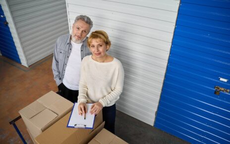 Woman notes information of storage boxes standing near client