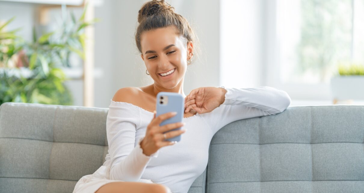 Young woman is using phone for video call