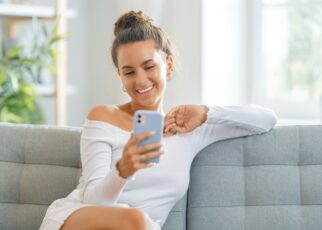 Young woman is using phone for video call