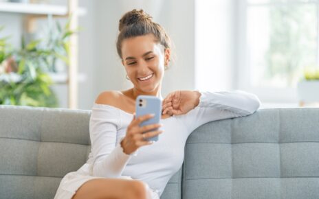 Young woman is using phone for video call