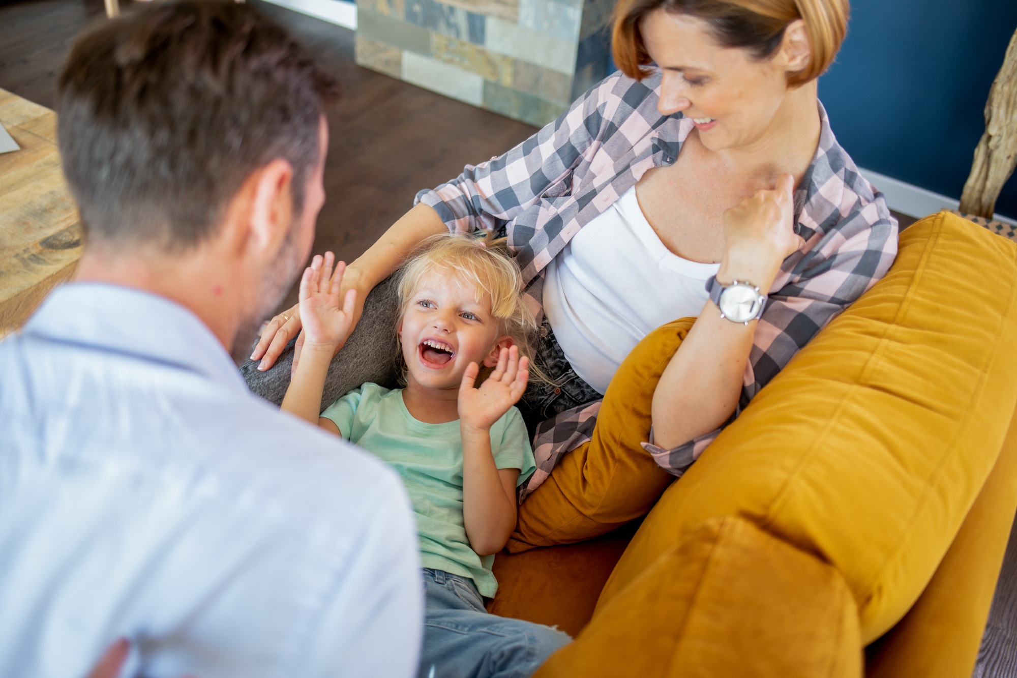 Happy family activities together on the sofa at home
