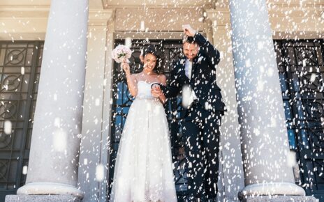 Newly married couple leaving the church.